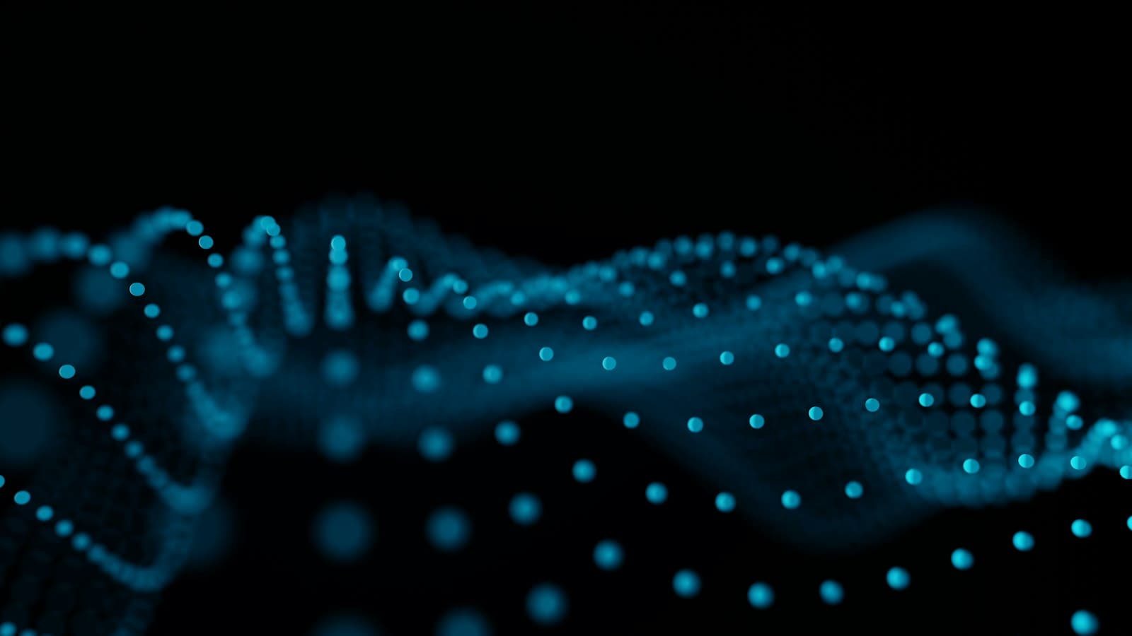 Glowing blue particles forming wave patterns