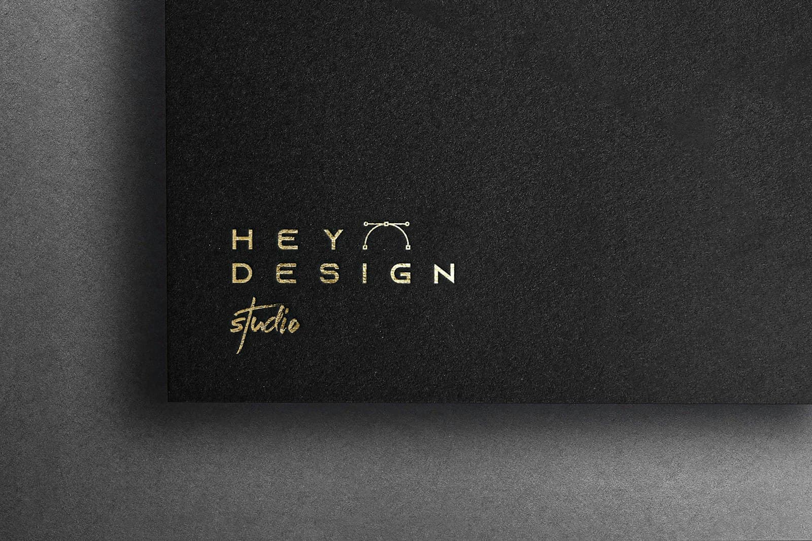 Embossed logo on dark textured paper
