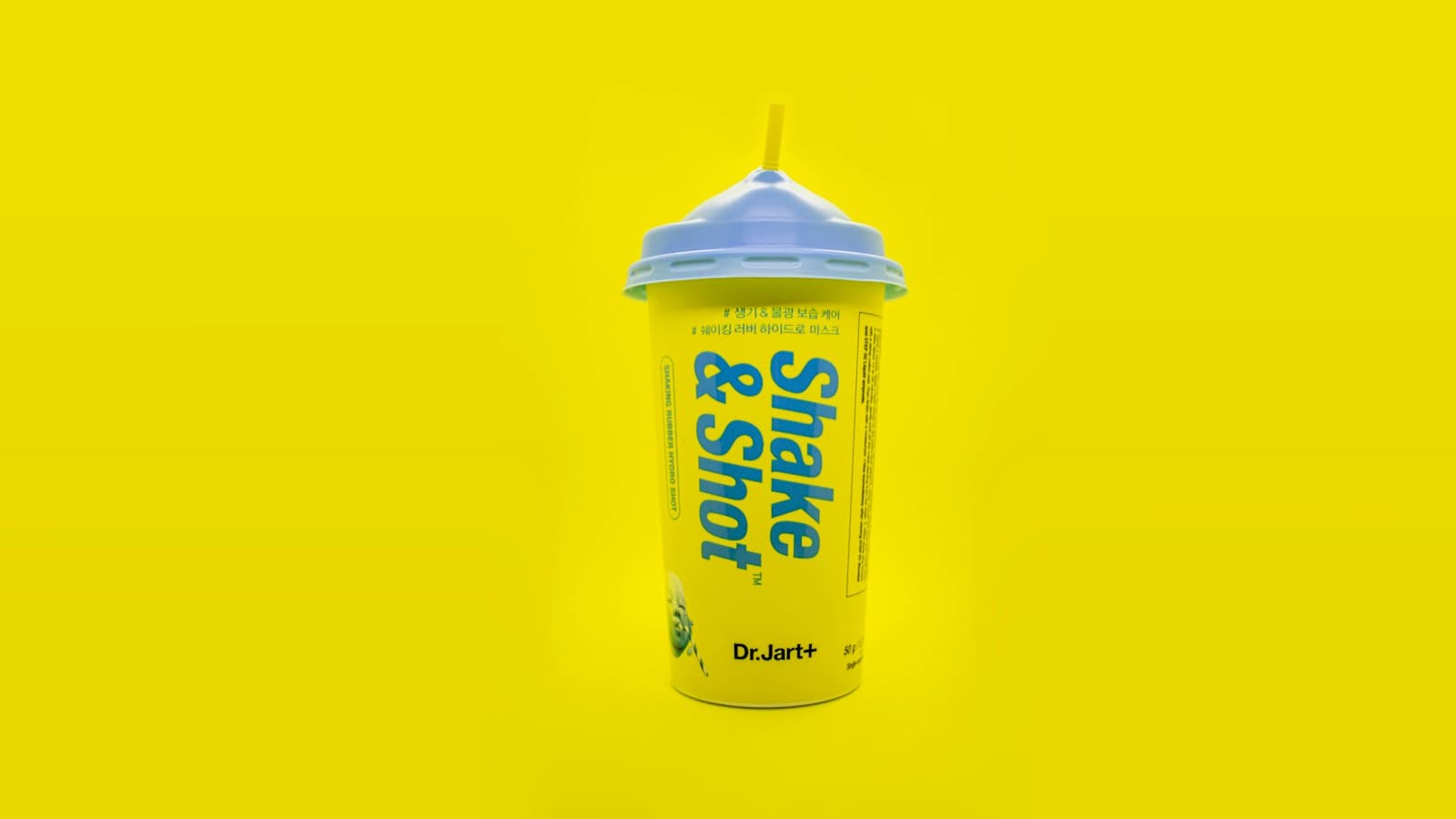Product shot of a branded cup on a yellow background
